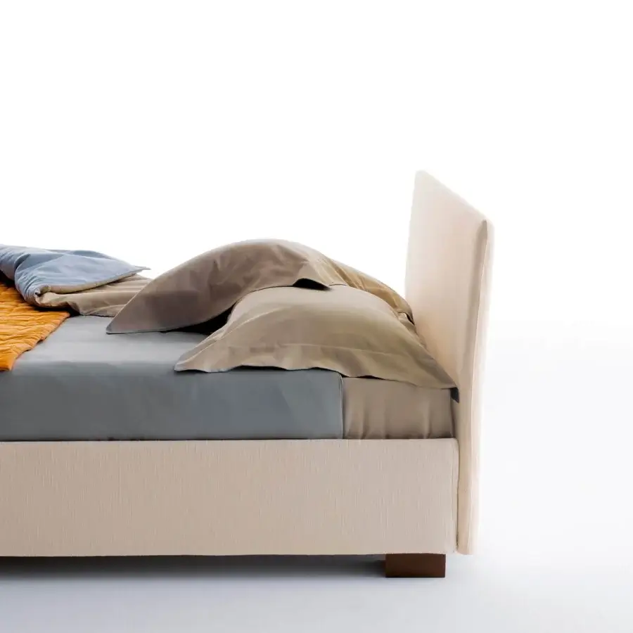 Exceptional Horm Figi bed with light beige textile upholstery and mocha lacquered solid beechwood feet