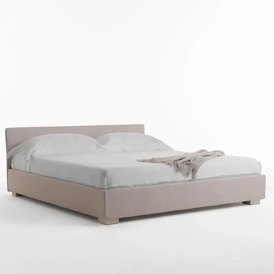 Luxury Horm Figi bed with light beige textile upholstery and solid beechwood legs with a natural lacquer finish