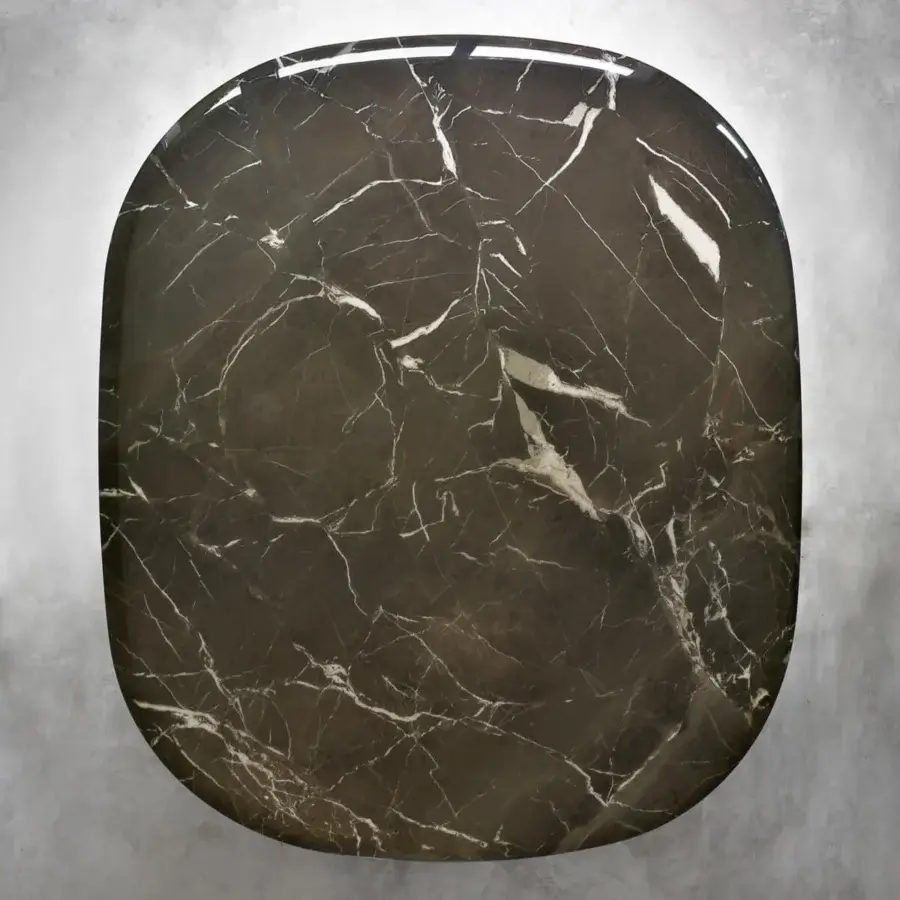Distinguished Casa Casati Musa table with dark marble top and glossy finish, built with a sculpted polyurethane resin base