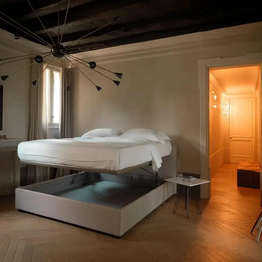 Elegant Horm Lipari Plus bed in light gray textile with smooth finish and mocha lacquered solid beechwood feet