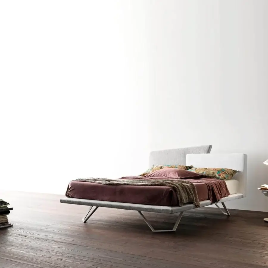 Avant-garde Presotto Meeting bed with trapezoidal headboard upholstered in light gray textile with matte finish