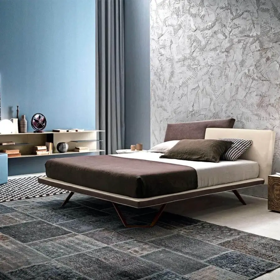 Harmonious Presotto Meeting bed with light beige textile upholstery, a brown section and bronze metal feet