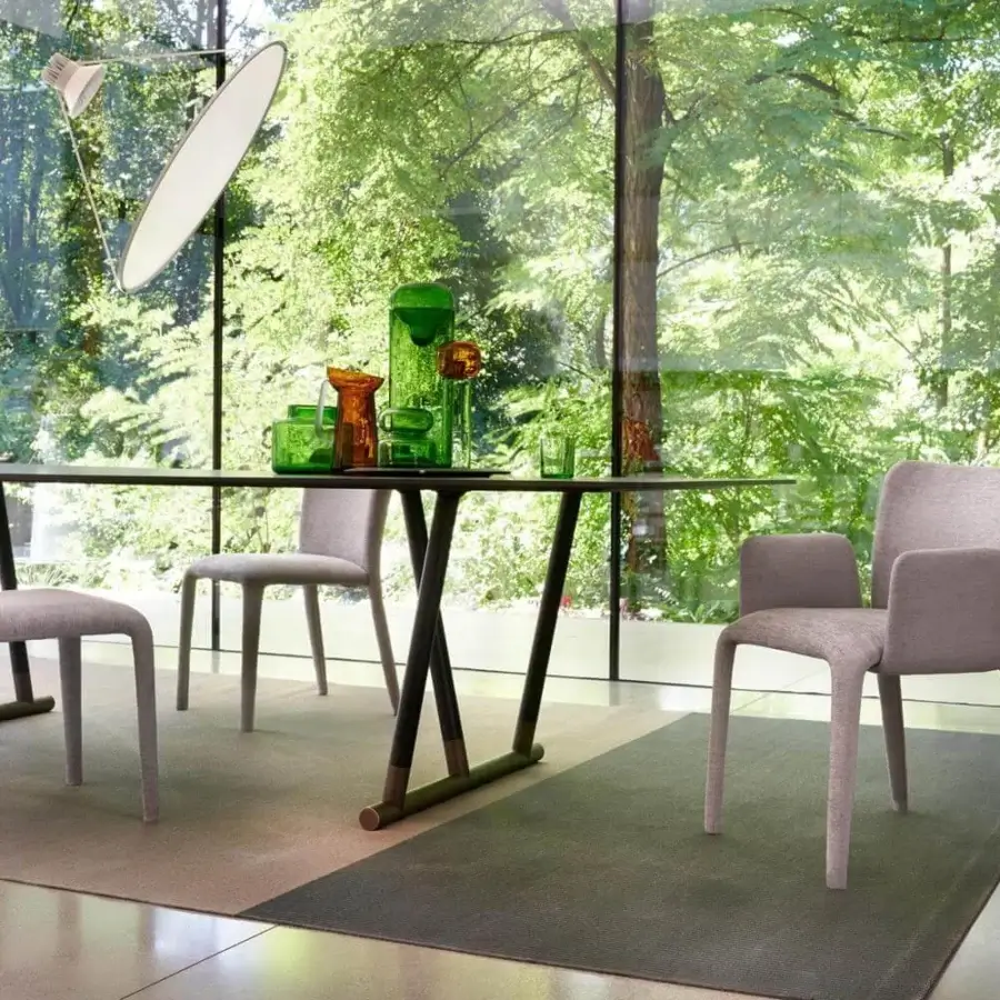 Innovative Potocco Lars chair in light gray fabric with sinuous legs and tailored polyurethane molded structure