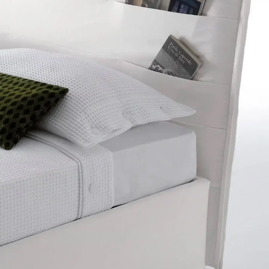 Exceptional Horm Tasca bed with crisp white fabric upholstery and mocha lacquered solid beechwood feet