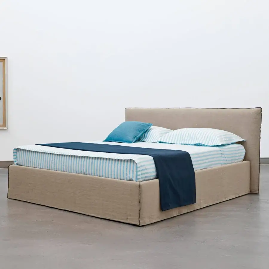 Superior Horm Tahiti bed with light beige textile upholstery and mocha lacquered solid beechwood feet