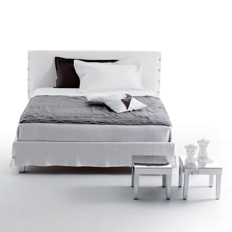 Elegant Horm White bed with off-white textile upholstery, subtle button embellishments and discreet metal legs