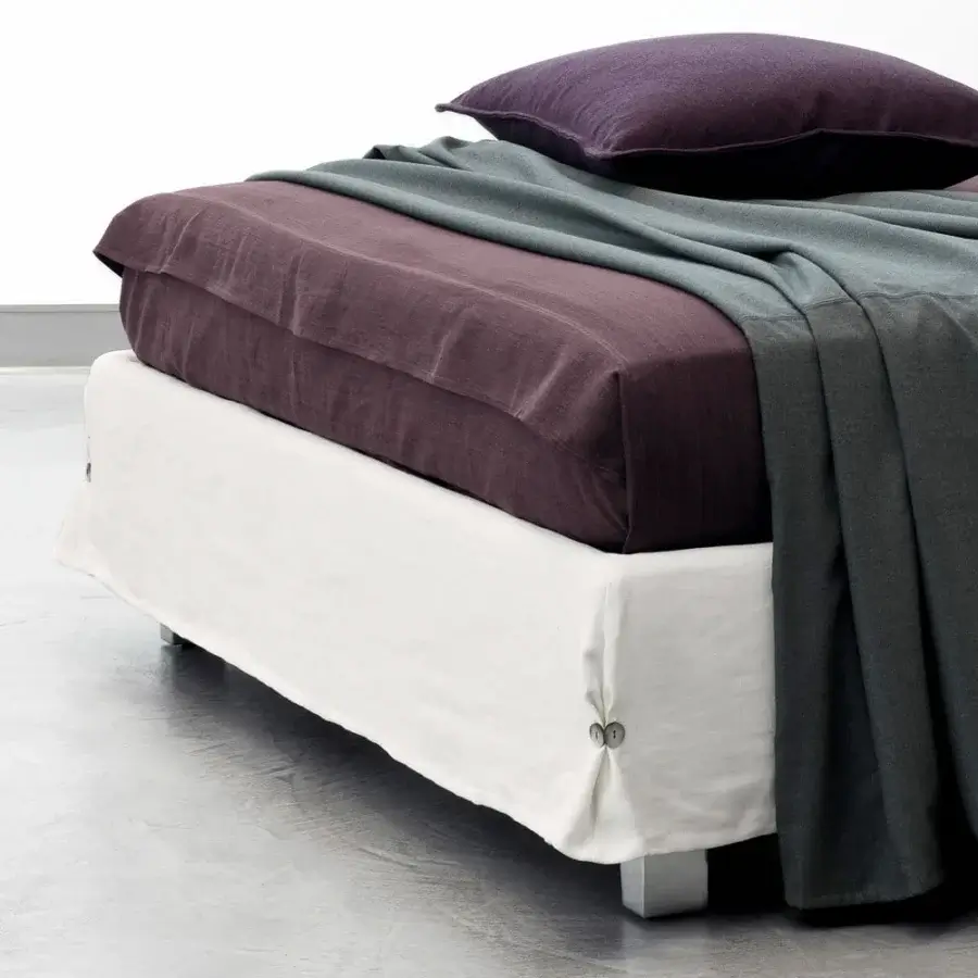 Superior Horm White bed with plum textile cover and white eco-leather skirt, built with lacquered beechwood feet