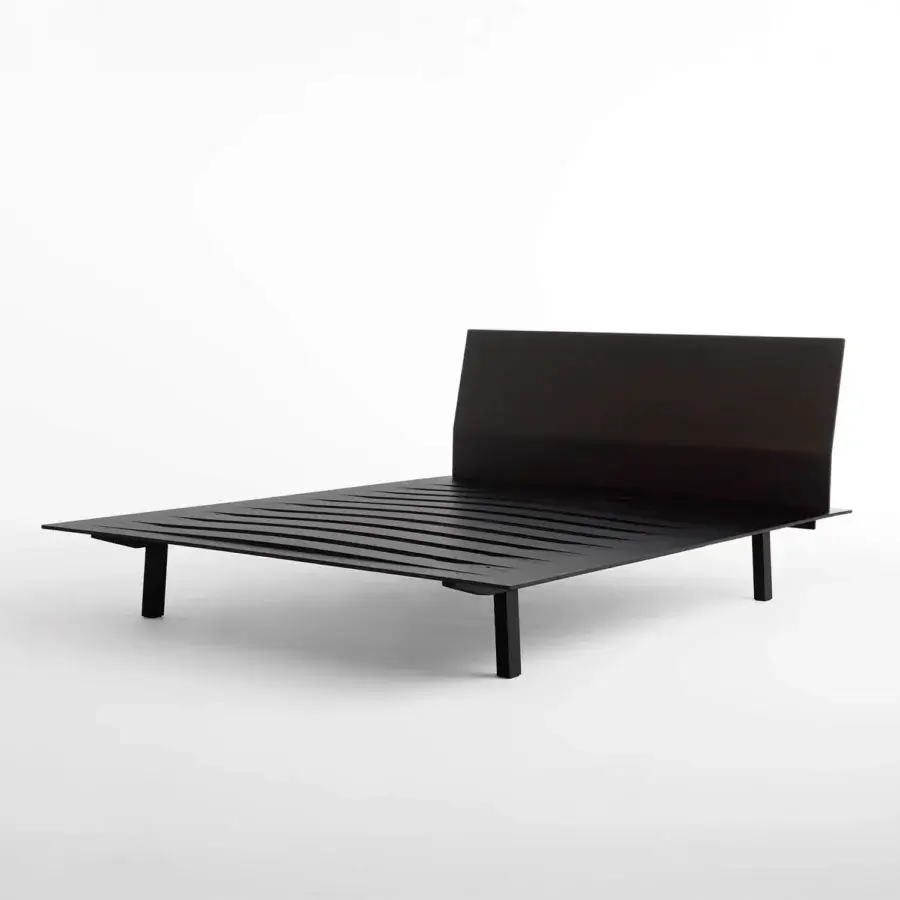 Elegant Horm Sottiletto bed with dynamically shaped plywood headboard and square veneered plywood feet in a dark matte finish