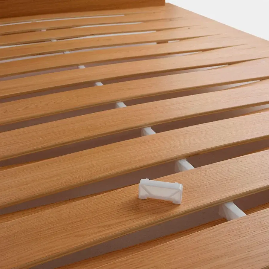 Exceptional Horm Sottiletto bed crafted in light brown oak plywood with a dynamically shaped headboard and white connectors