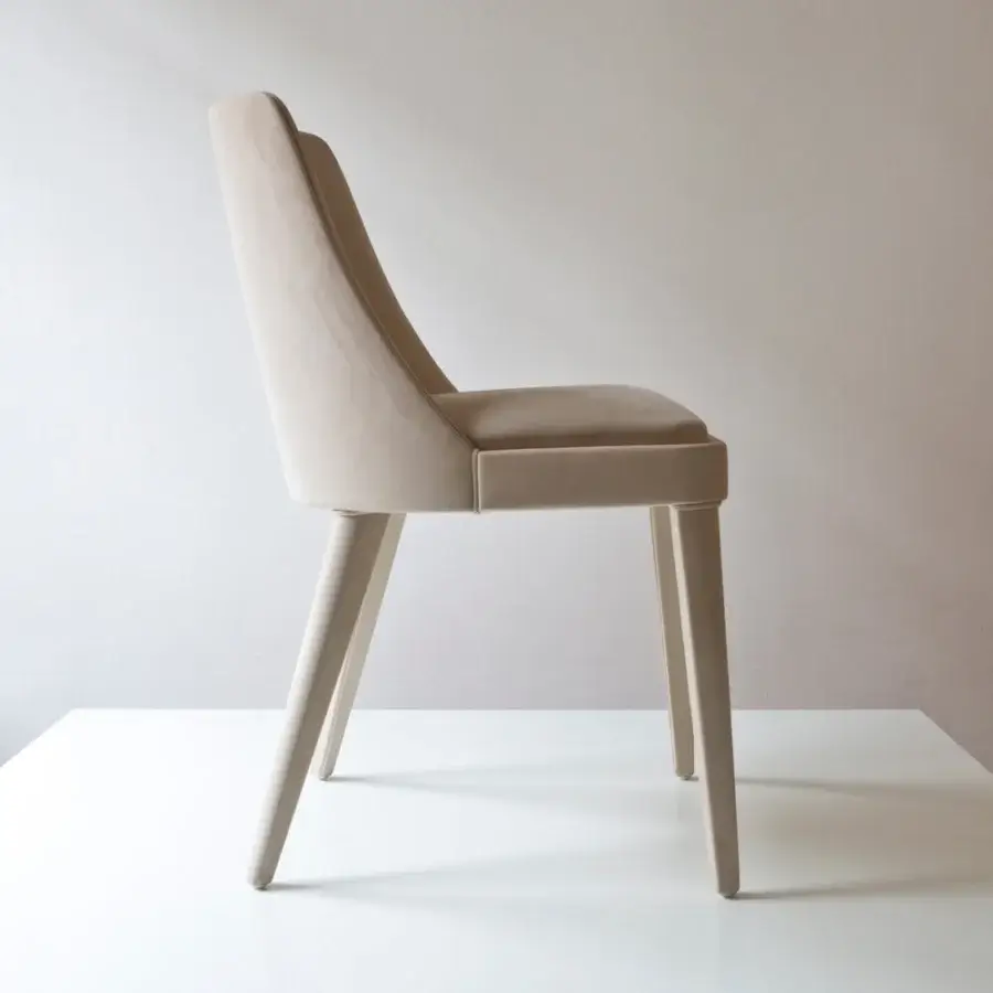 Distinguished Casa Casati Lola chair with long tapered beech wood legs and light beige fabric upholstery with refined piping