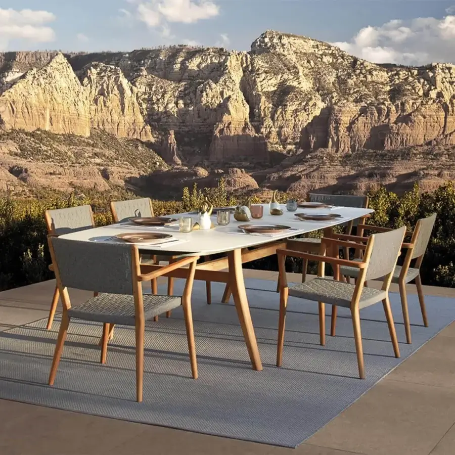 Elegant Royal Botania Zidiz table with light-colored tabletop and teak wood frame in a natural finish