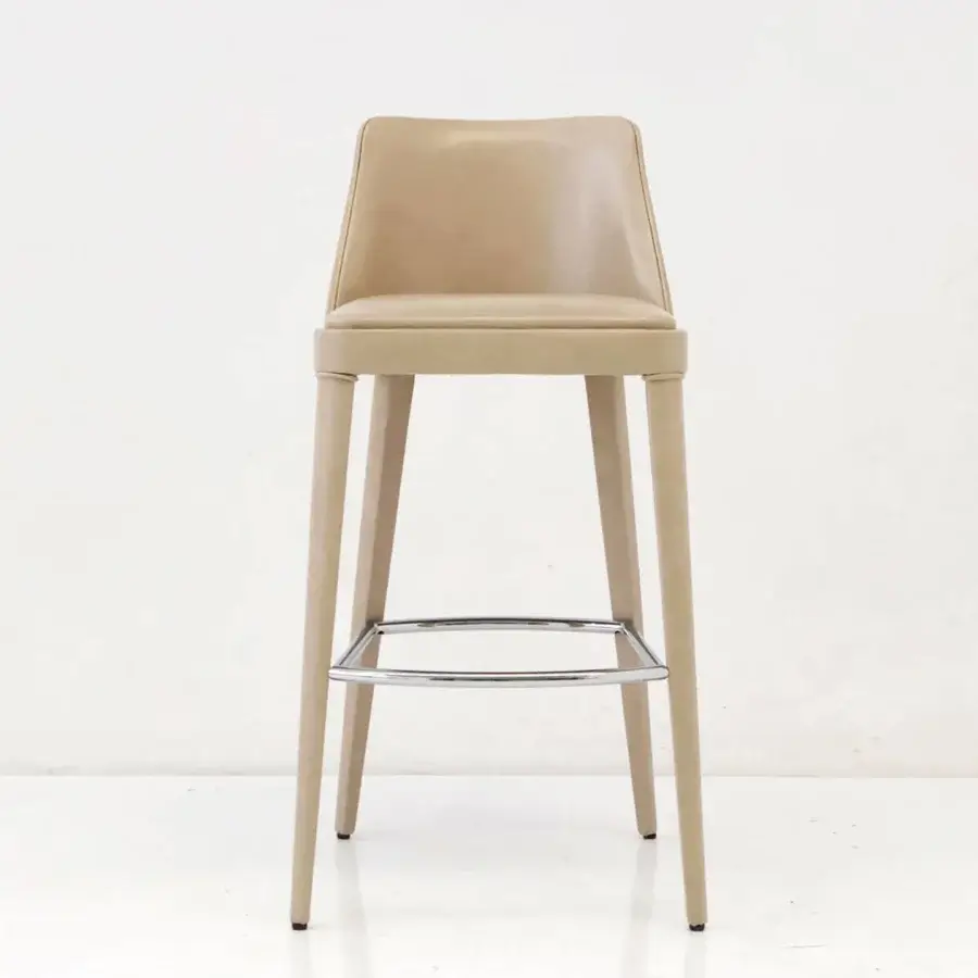 Elegant Casa Casati Lola stool with light tan upholstery and curving beech wood built with a rectilinear silhouette and chrome footrest