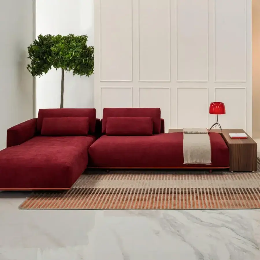 Exceptional Horm Billie sectional with light aluminum frame enveloped in deep red textile and a small attached wooden side table