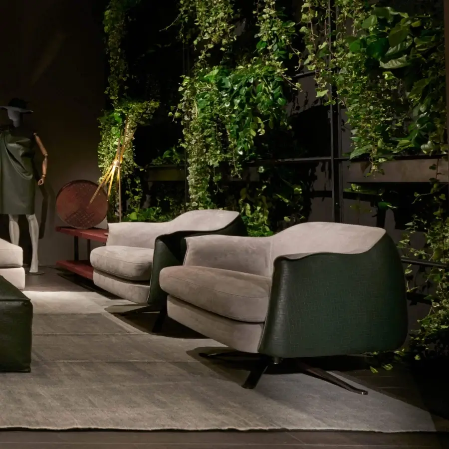 Sophisticated Cierre1972 Bohème swivel lounge chair with muted gray textile and dark green synthetic shell, built with a brushed metal base