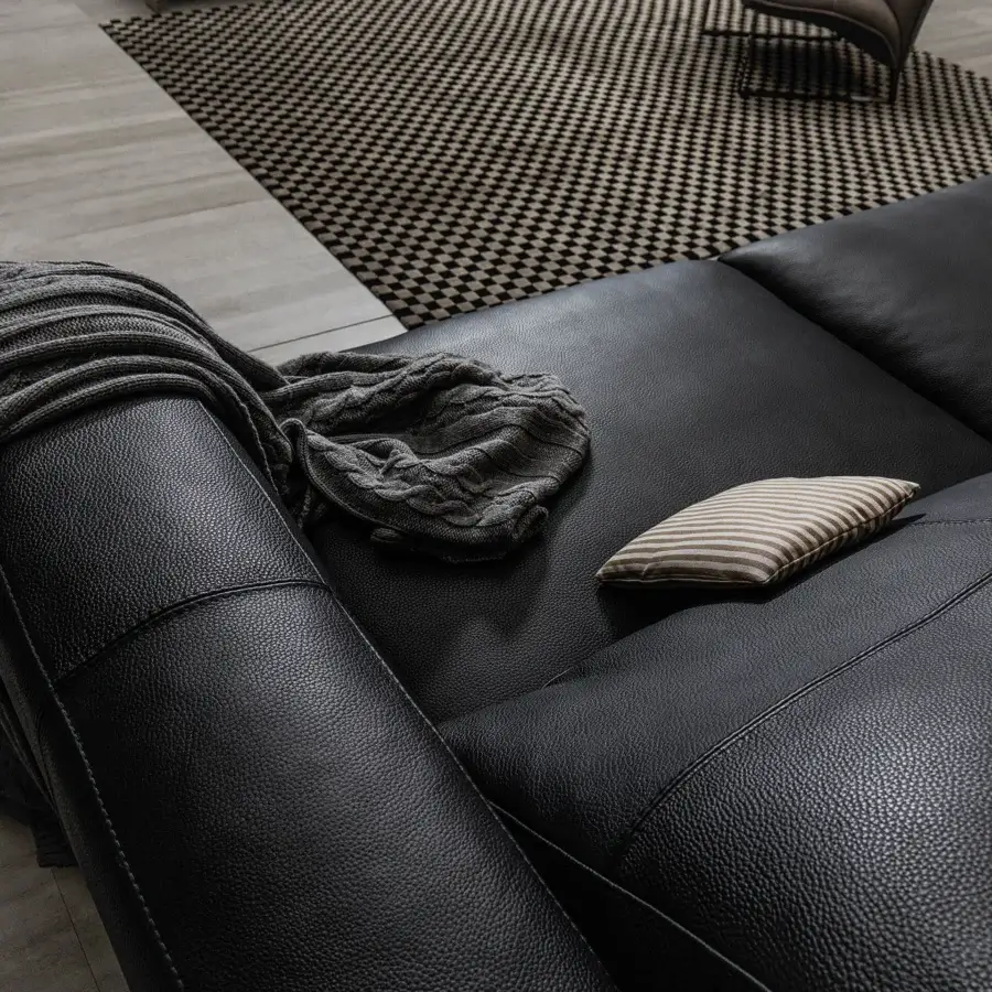 Elegant Cierre1972 Dolce Vita sofa with dark textured upholstery, geometric form and sleek metal base