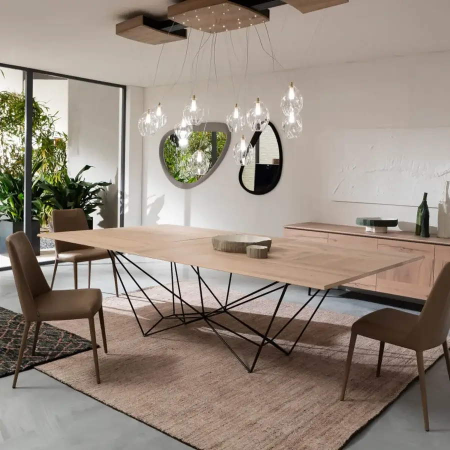 Distinguished Ozzio Italia Fil8 extendable table with a light brown wooden top and black metal rod base in a matte finish