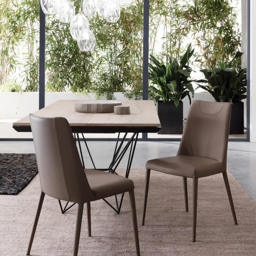 Distinguished Ozzio Italia Fil8 extendable table with a light wood tabletop and intersecting black metal base