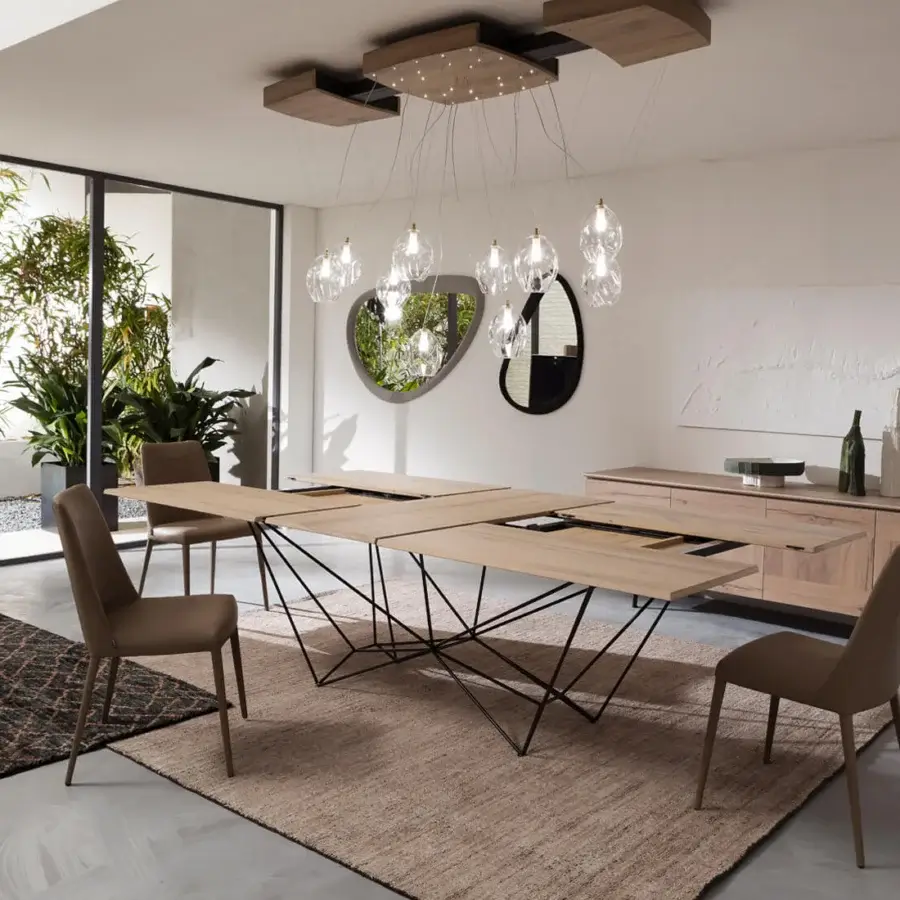 Elegant Ozzio Italia Fil8 extendable table built with light brown wood and a geometric black metal base