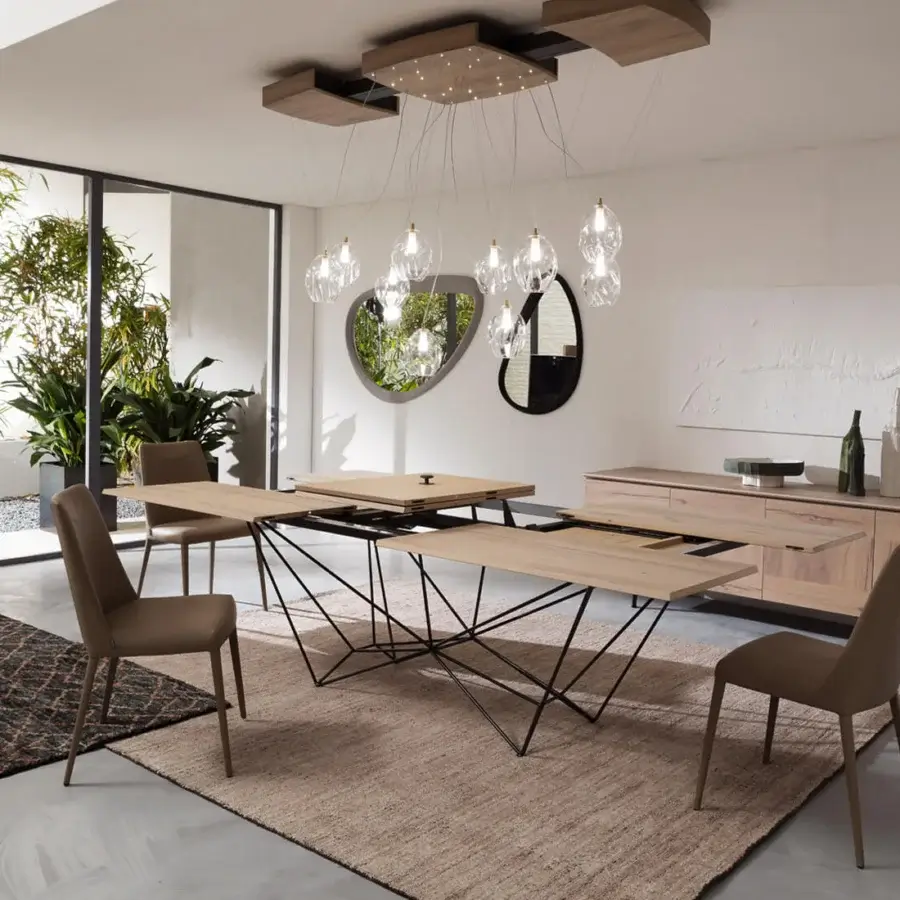Distinguished Ozzio Italia Fil8 extendable table built with wood and metal rods in a light natural finish with contrasting darker tones