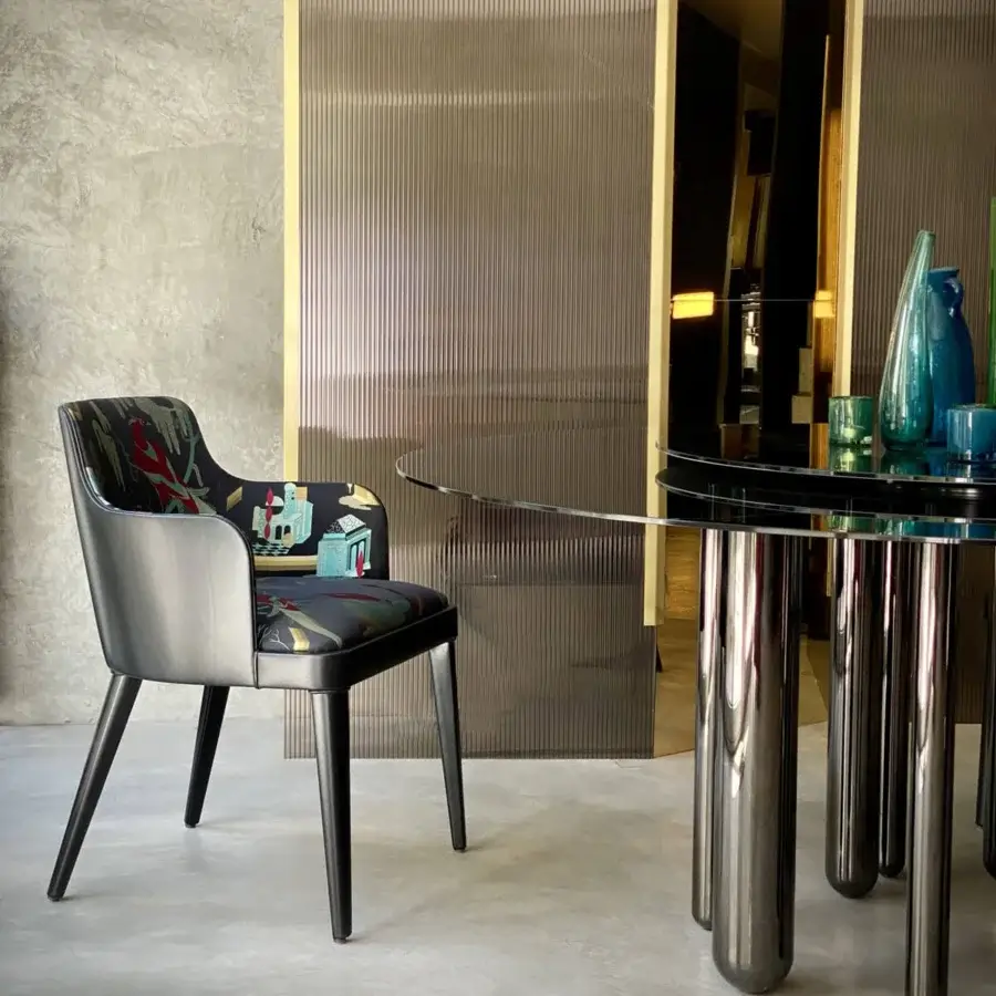 Superior Casa Casati Lola Royale chair built with beech wood and upholstered in colorful textile with dark gray leather accents