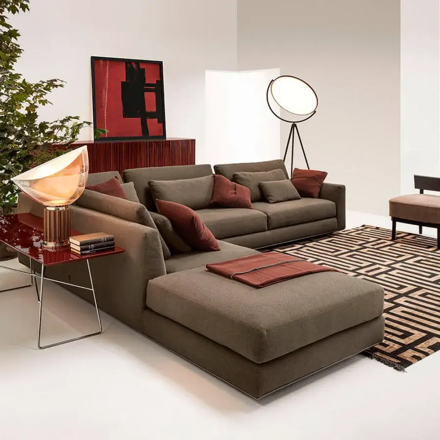 Exceptional Horm Ellington sectional with aluminum frame enveloped in tailored woven textile and reddish-brown pillows