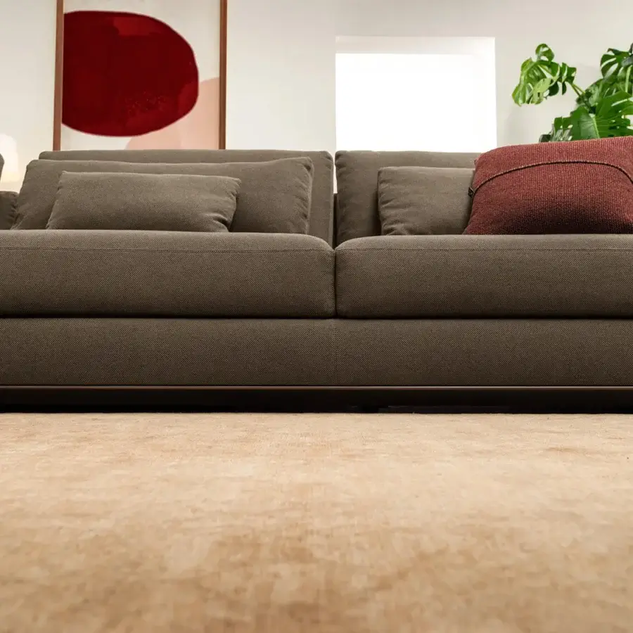 Superior Horm Ellington sectional with light aluminum frame enveloped in dark brown woven textile and includes back cushions