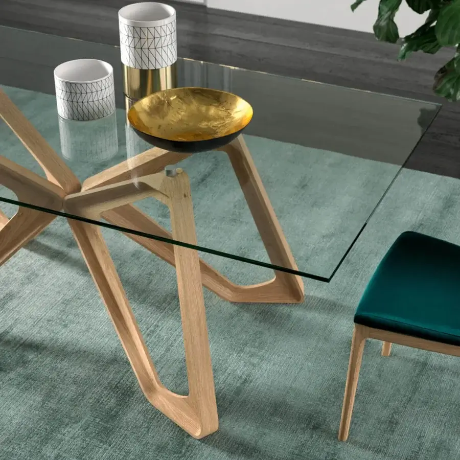 Elegant Ozzio Italia Papillon table with a sinuous light solid wood base and clear glass top in a smooth matte finish