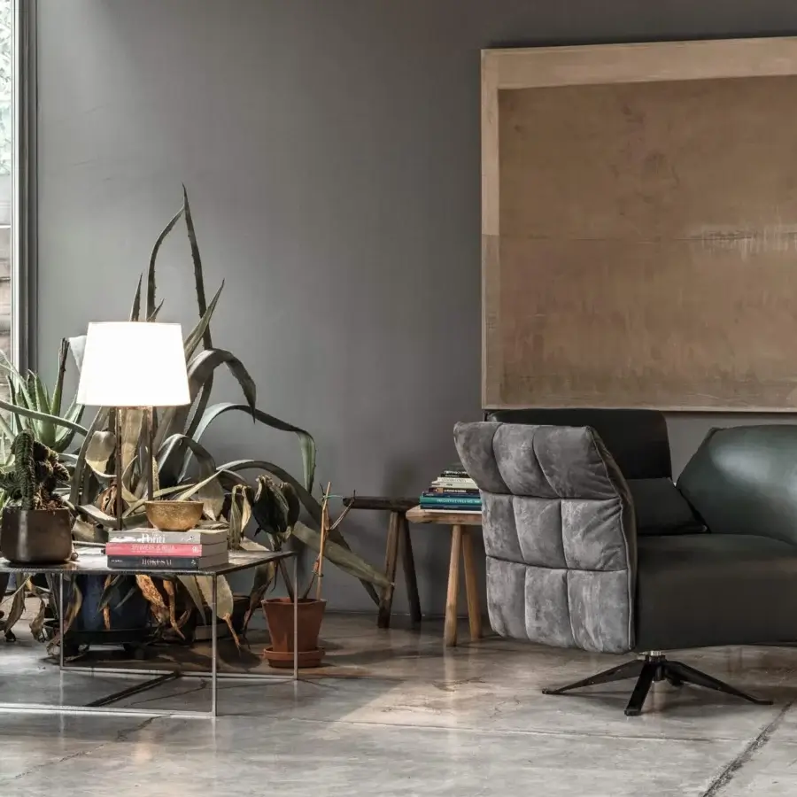 Sophisticated Cierre1972 Eva II swivel lounge chair crafted in supple leather and textile with a dark green and gray palette