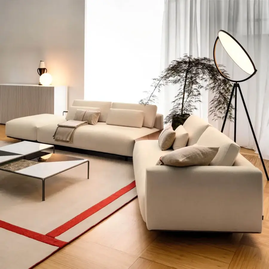 Distinguished Horm Ragtime sectional sofa with light beige textile upholstery and a matte finish resting on a dark base