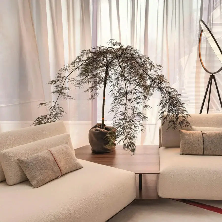 Sophisticated Horm Billie sectional with light beige textured upholstery and an ecological aluminum frame built with subtle red stripes