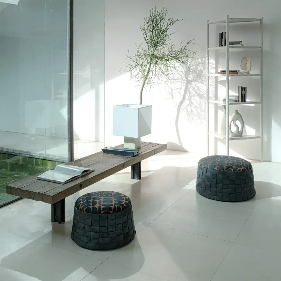 Distinctive Cierre1972 Dama ottoman with dark gray woven-leather base and patterned textile top in abstract geometric shapes