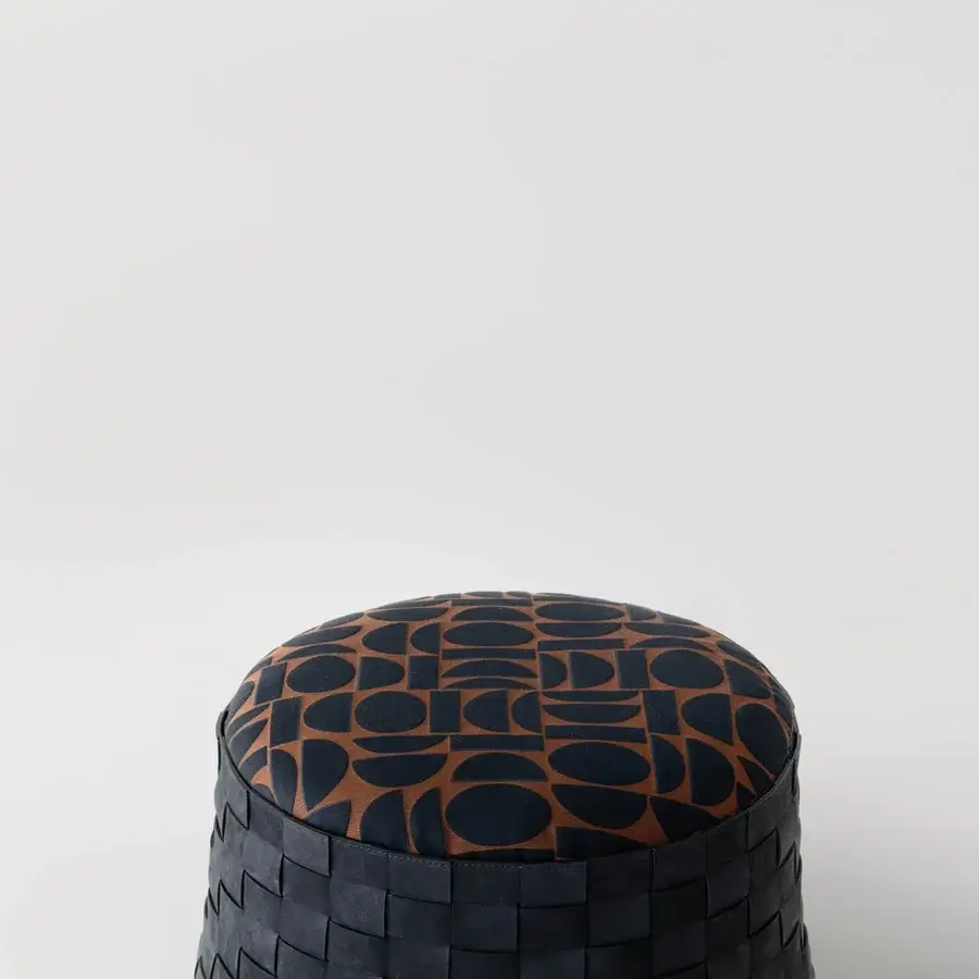 Captivating Cierre1972 Dama ottoman with woven leather structure and contemporary geometric dark blue and tan pattern