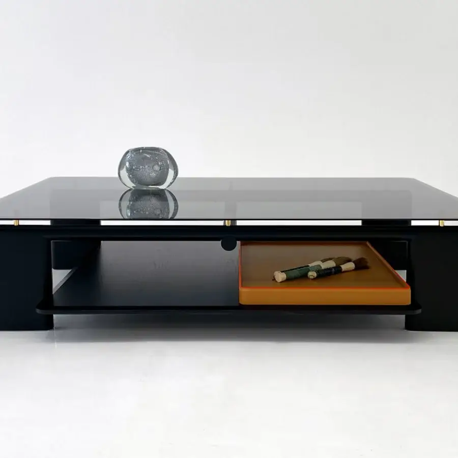 Superior Casa Casati Toro coffee table built with transparent tempered glass and dark finished solid ash wood, including a light brown leather tray