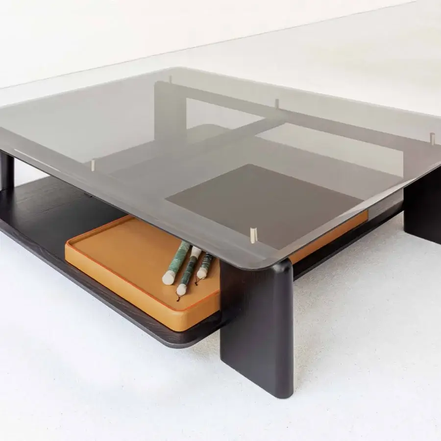 Elegant Casa Casati Toro coffee table built with transparent tempered glass and solid ash wood, including a lighter brown leather tray