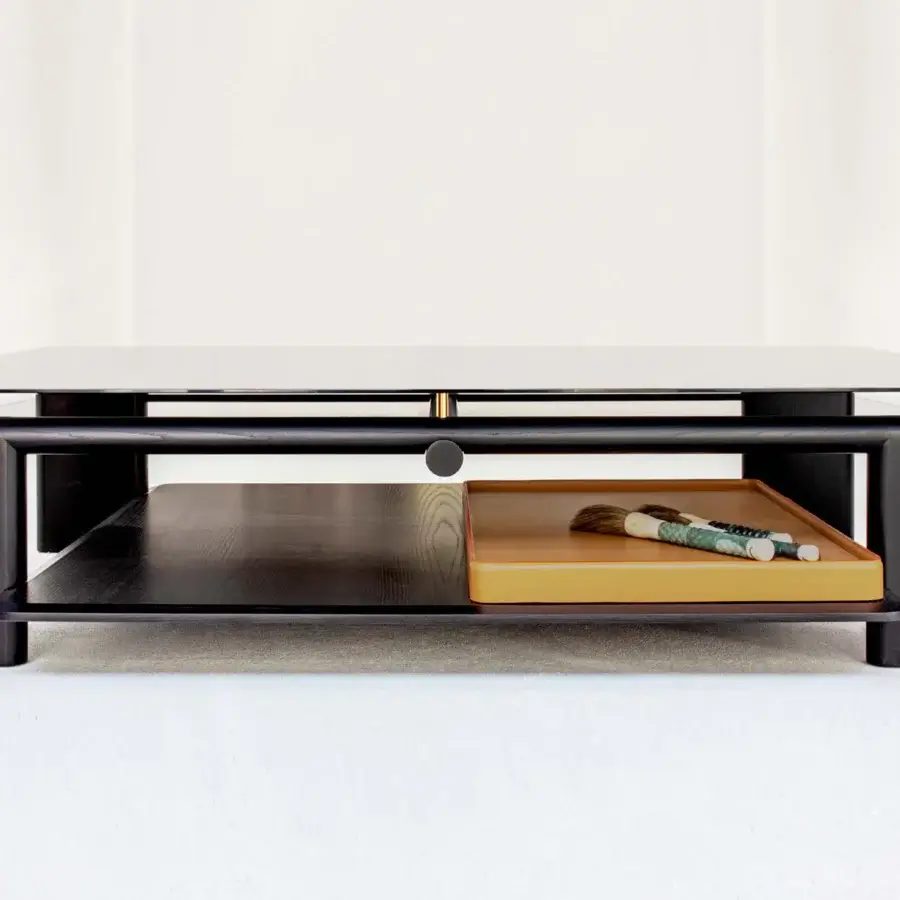 Superior Casa Casati Toro coffee table crafted with dark stained solid ash wood and transparent tempered glass with a light tan leather tray