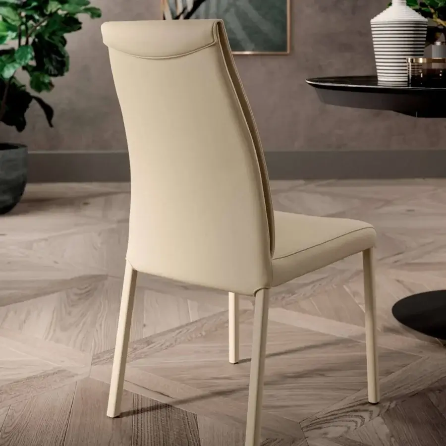Distinguished Ozzio Italia Megan chair with delicate curves and a smooth light cream synthetic padded seat