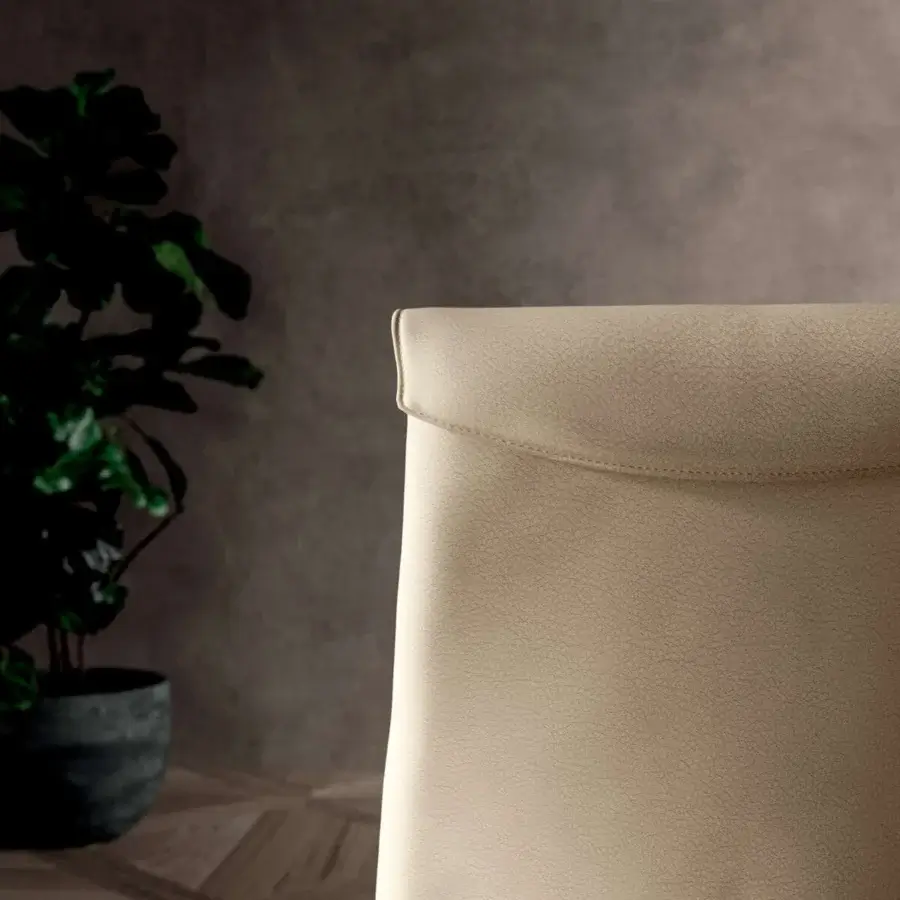 Captivating Ozzio Italia Megan chair with delicate curves upholstered in light beige leather-like material and a fine textured finish