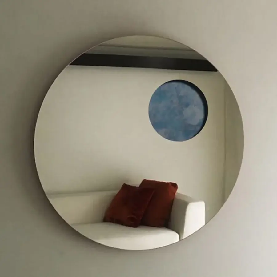 Captivating Casa Casati Transito mirror with lacquered MDF, a blue sky cut-out, and a matt orange lacquered back panel