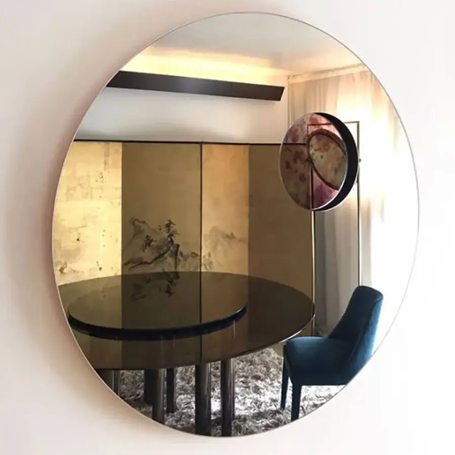 Exclusive Casa Casati Transito mirror with textured overlapping circles in brown, red, and purple hues plus matt orange lacquered MDF backing