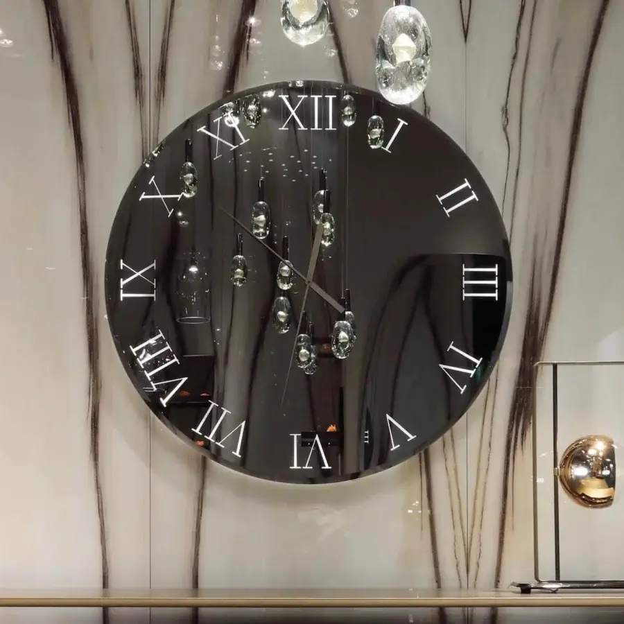 Distinguished Reflex Titanium Clock, a timepiece with smoked mirror glass and titanium hands, exhibiting a minimalist reflective surface