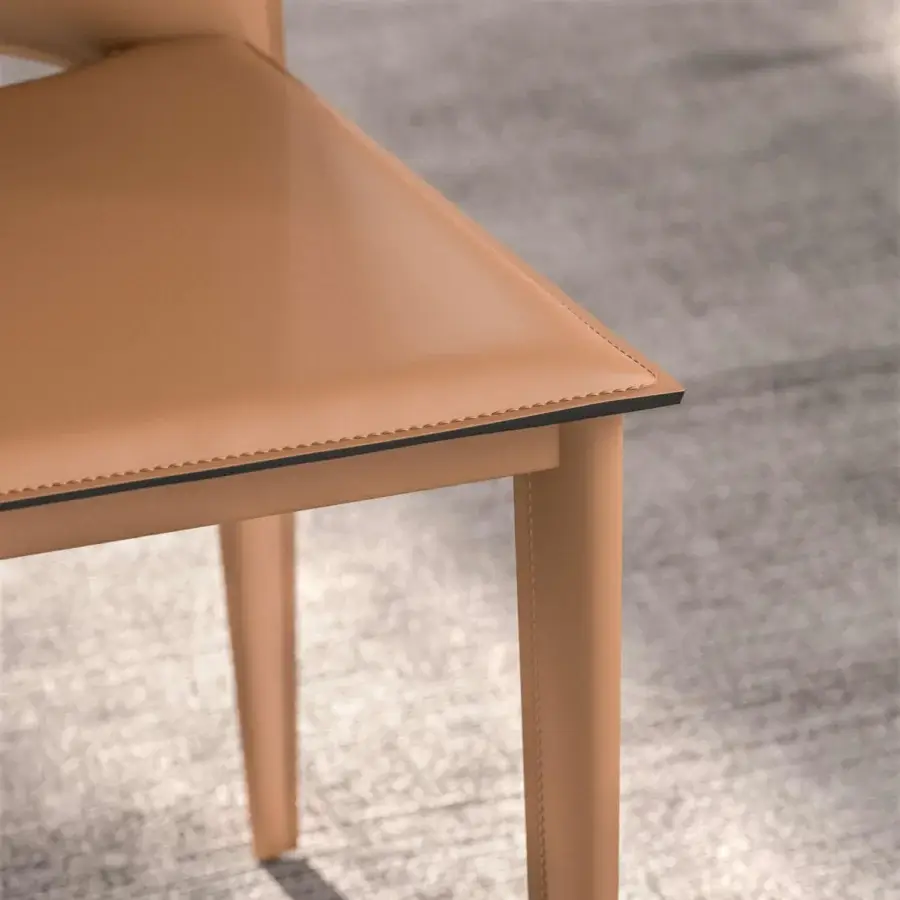 Superior Ozzio Italia Viva chair expertly crafted in Italy with smooth tan treated leather and balanced angular lines