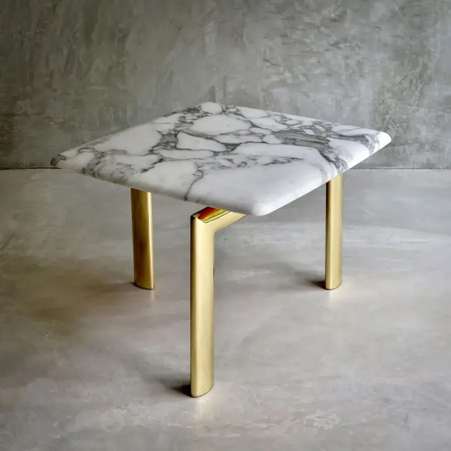 Exceptional Casa Casati Sasso side table with white marble-like top and glossy golden metal legs built with polyester lacquer