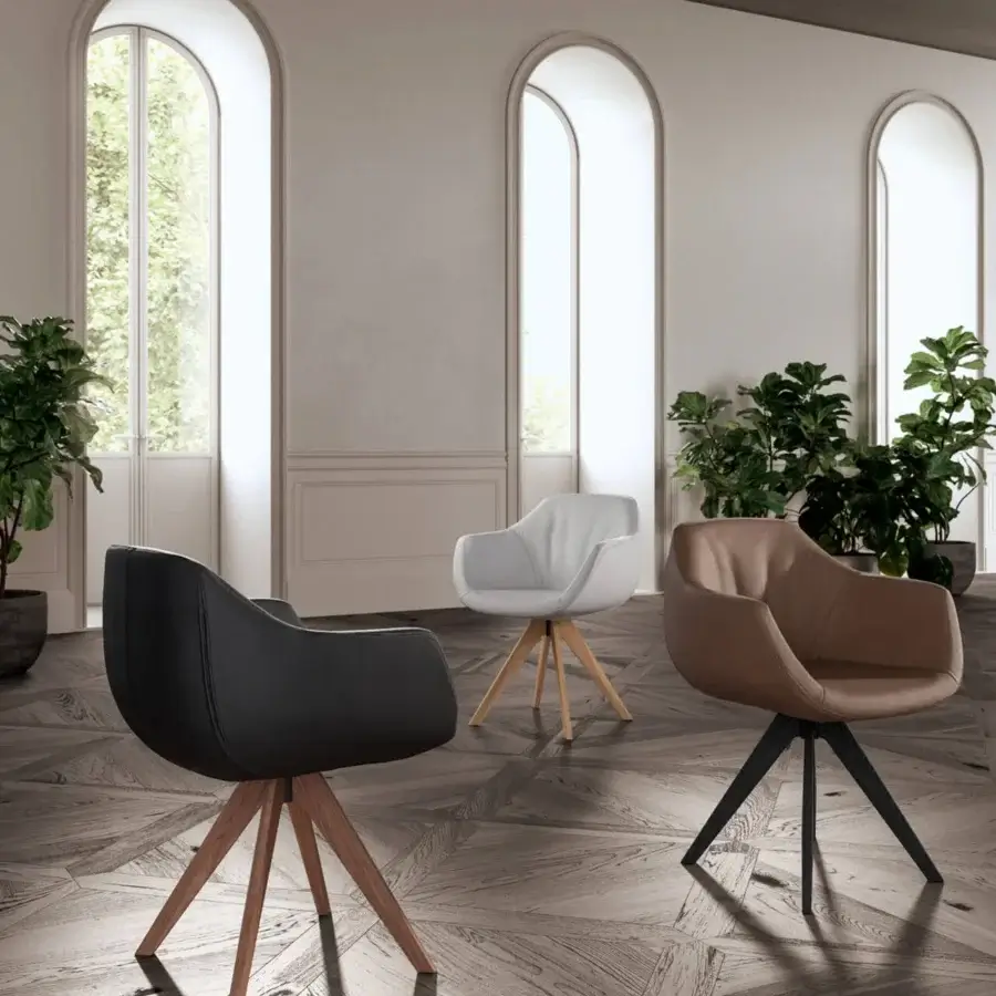 Elegant Ozzio Italia Delia - Halia armchair with light brown upholstery and dark metal four-legged support