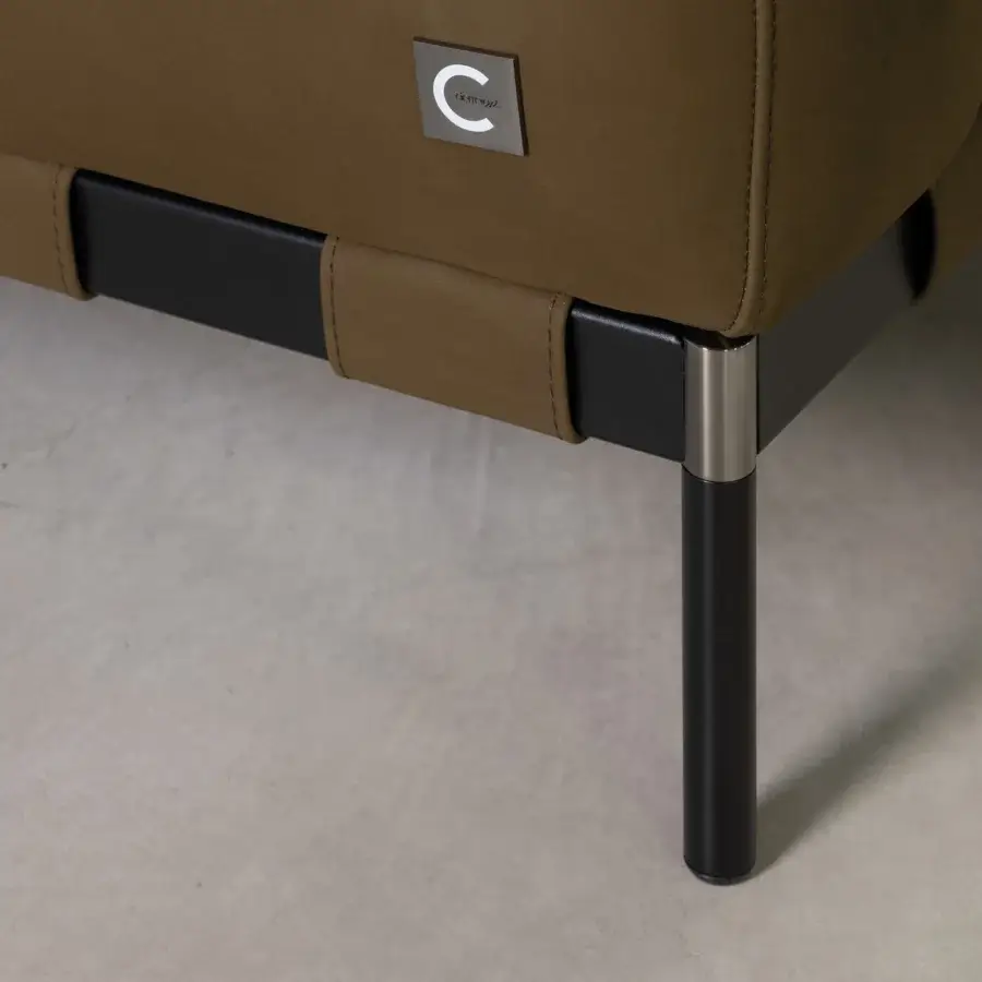 Superior Cierre1972 Oscar lounge chair in muted brown leather or textile with matte finish and customizable strap detail