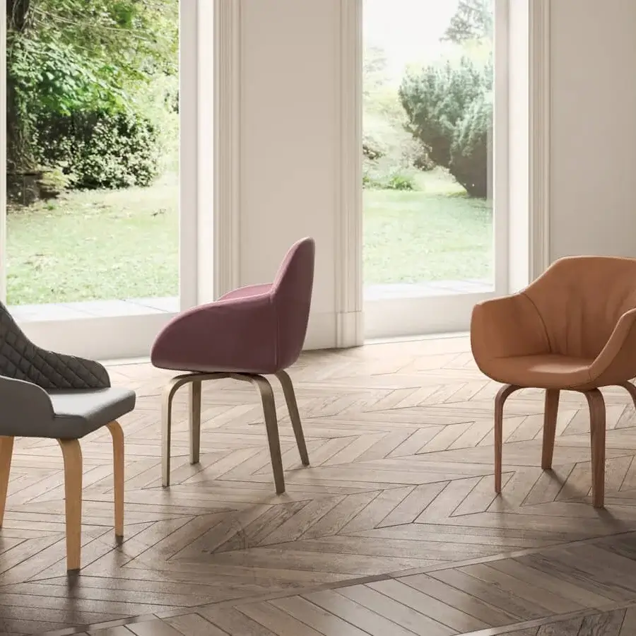 Elegant Ozzio Italia Eliot armchair with tan leather upholstery and coordinating wood frame built with curvilinear armrests
