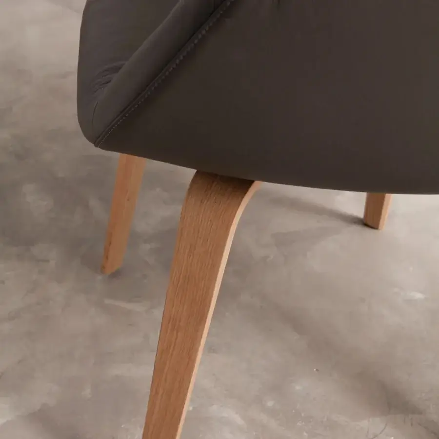 Distinguished Ozzio Italia Eliot armchair with dark gray upholstery and elegantly curved light-toned wooden legs
