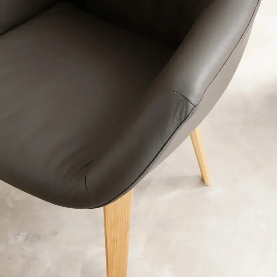 Exceptional Ozzio Italia Eliot armchair with dark gray leather upholstery and light-colored wooden legs
