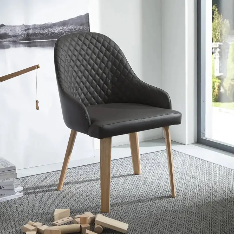 Distinguished Ozzio Italia Atena Demetra armchair with quilted backrest and dark upholstery in a light-toned wooden base