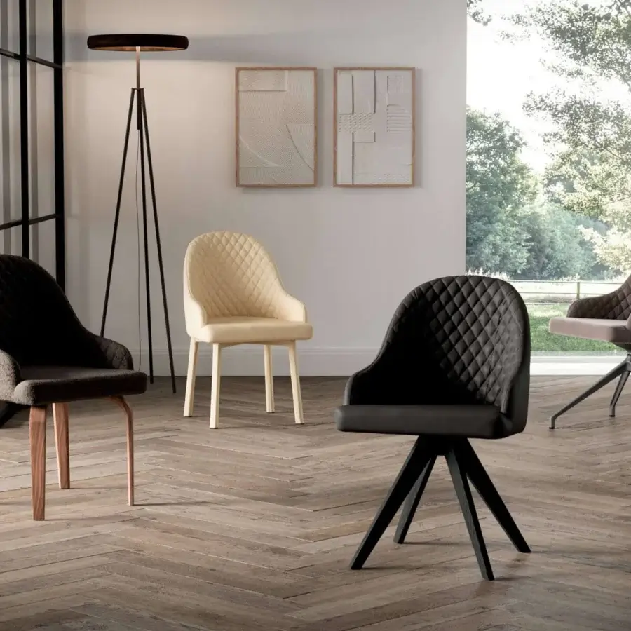 Exceptional Ozzio Italia Atena Demetra armchair with dark gray quilted textile and smooth wood legs