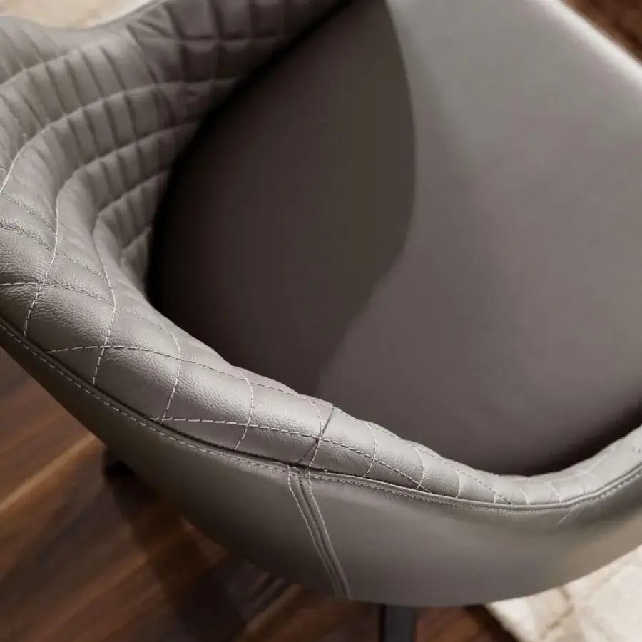 Sophisticated Ozzio Italia Olimpia - Gilda armchair upholstered in muted gray synthetic material with quilted backrest and slender base